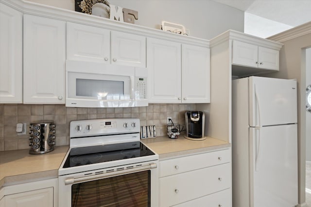 kitchen with white cabinets, white appliances, and decorative backsplash