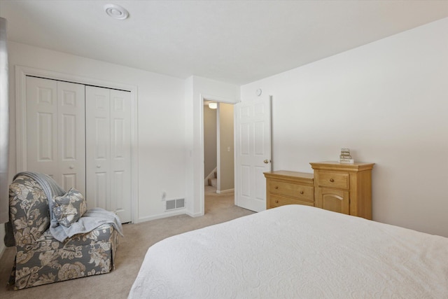 carpeted bedroom with a closet