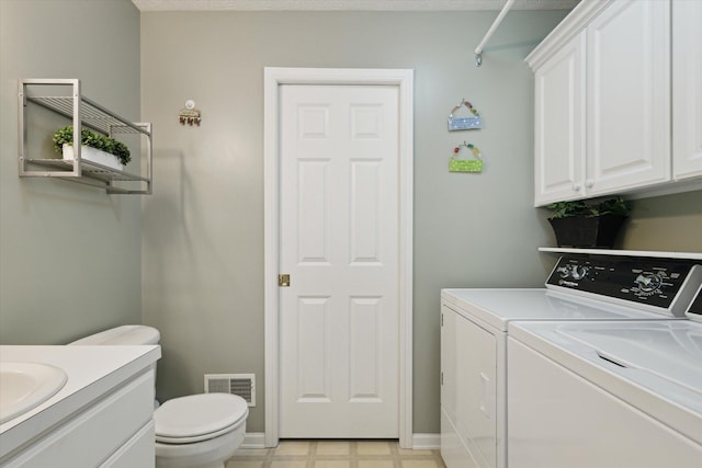 laundry area with washing machine and dryer