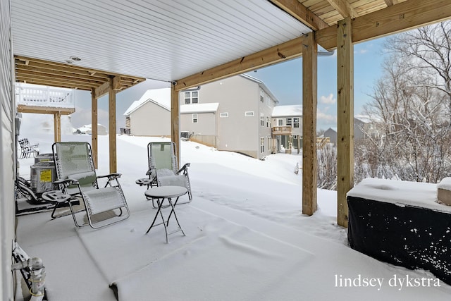 view of snow covered patio