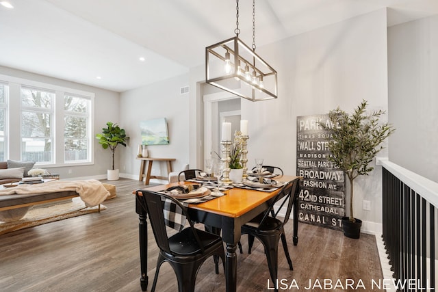 dining space featuring dark wood-type flooring