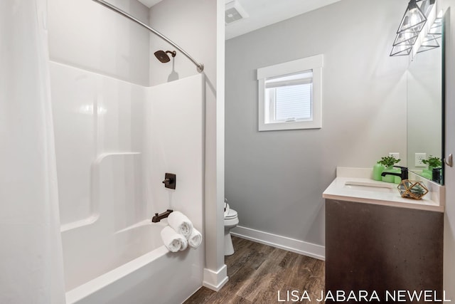 full bathroom featuring vanity, tub / shower combination, wood-type flooring, and toilet