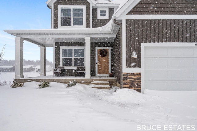 view of snow covered property entrance