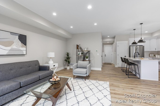 living room with light hardwood / wood-style floors