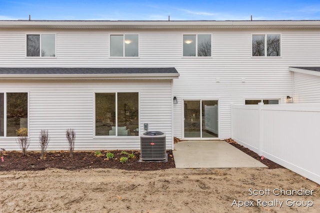 back of property featuring a patio area and central AC