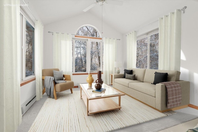 sunroom / solarium featuring ceiling fan, vaulted ceiling, and a baseboard heating unit