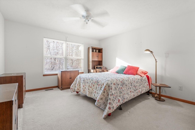 bedroom featuring ceiling fan and light colored carpet