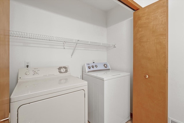 laundry area featuring separate washer and dryer