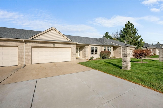 ranch-style house featuring a front lawn and a garage