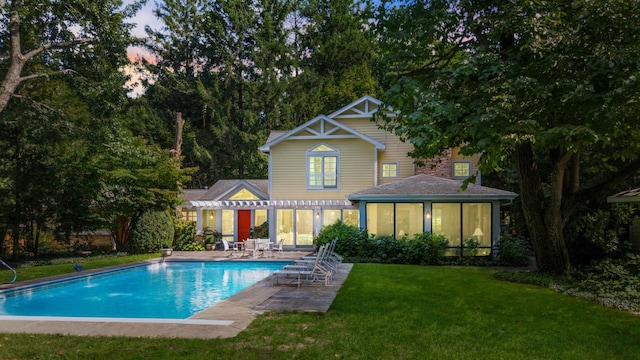 view of pool featuring a yard, a pergola, and a patio area