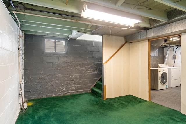 basement with washing machine and dryer and dark carpet