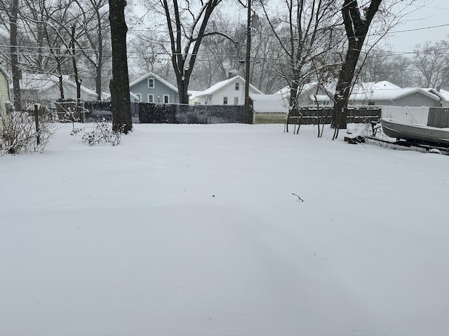 view of yard covered in snow