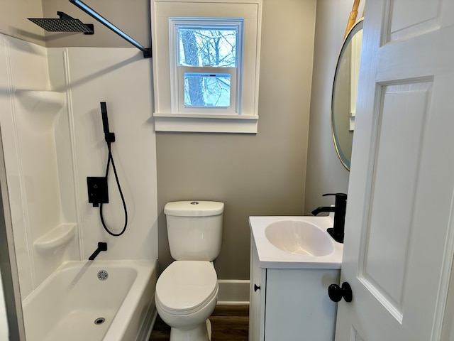 full bathroom featuring toilet, vanity, and bathing tub / shower combination