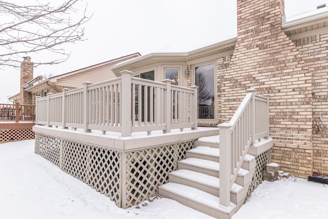 view of snow covered deck