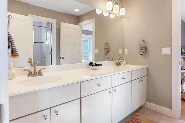 bathroom with vanity and tile patterned flooring