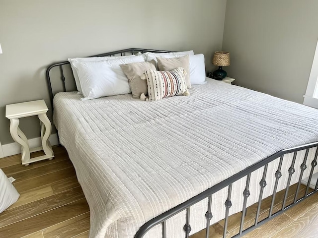 bedroom with hardwood / wood-style flooring