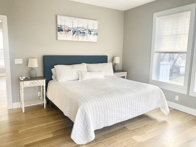 bedroom with wood-type flooring
