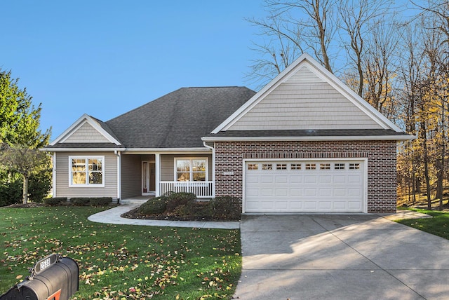 view of front of house featuring a garage, a porch, and a front yard