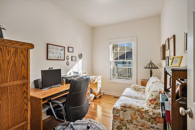 office space with hardwood / wood-style flooring