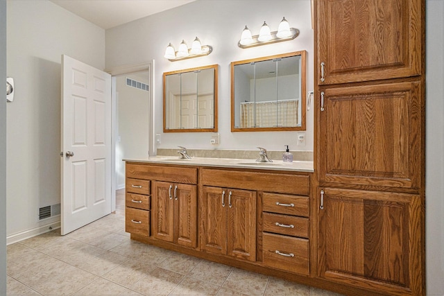 bathroom featuring tile patterned floors and vanity