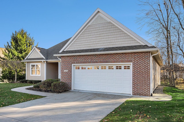 view of front of property featuring a garage and a front lawn