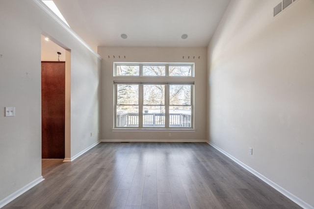 spare room with dark hardwood / wood-style flooring