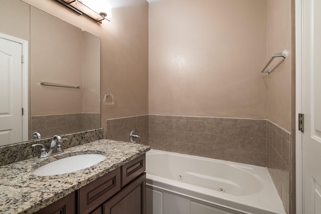 bathroom with a bathing tub and vanity