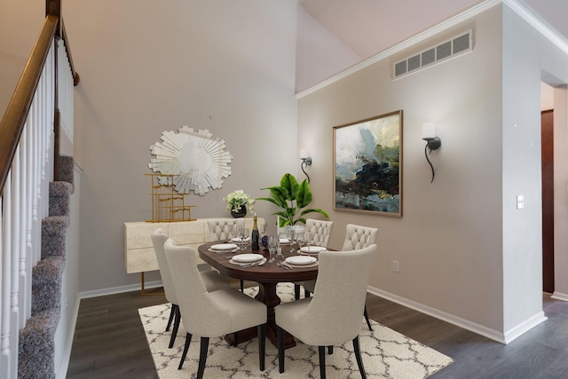 dining space with dark wood-type flooring