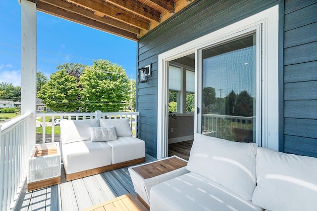 wooden deck featuring an outdoor hangout area