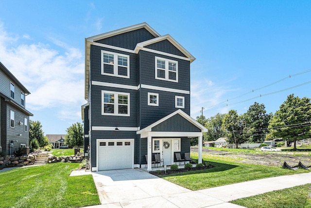 view of front of property featuring a garage and a front yard