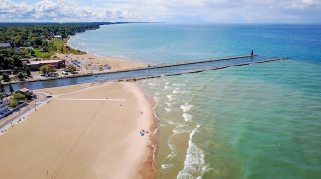 birds eye view of property featuring a water view and a view of the beach