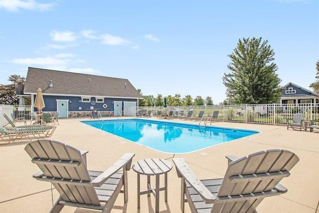 view of swimming pool with a patio area