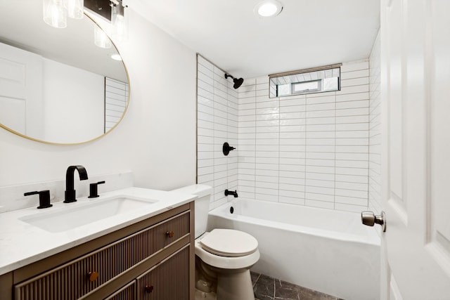 full bathroom featuring toilet, vanity, and tiled shower / bath combo