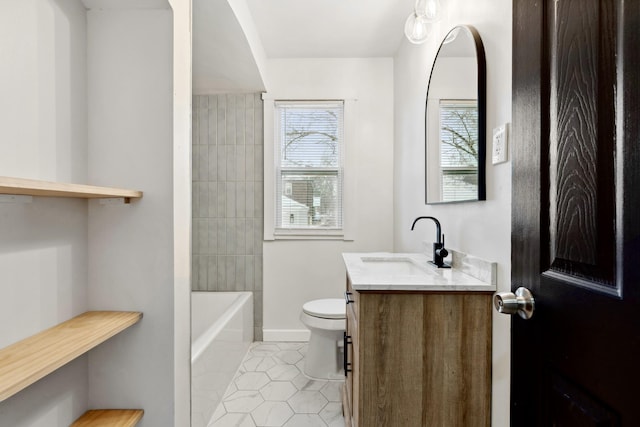 full bathroom with toilet, vanity, tiled shower / bath combo, and tile patterned flooring