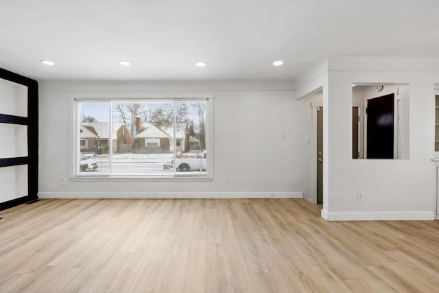 unfurnished living room with light wood-type flooring