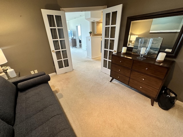 interior space with french doors and light colored carpet