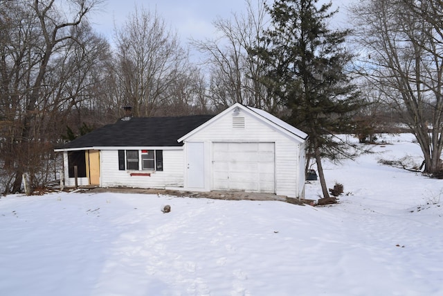 view of snow covered garage