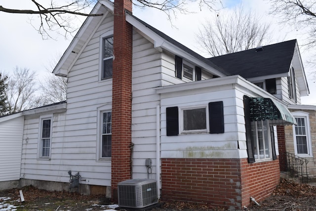 view of side of home with cooling unit