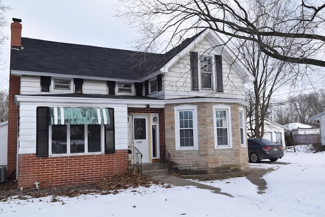 view of front of home featuring central air condition unit