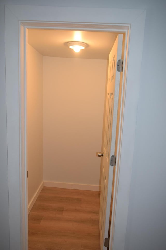 hall with light hardwood / wood-style flooring