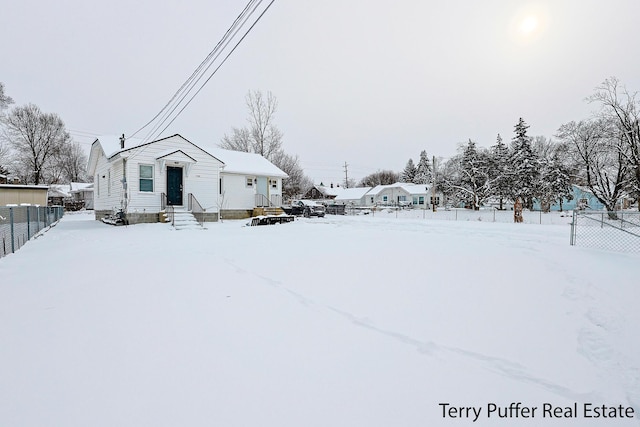 view of yard layered in snow