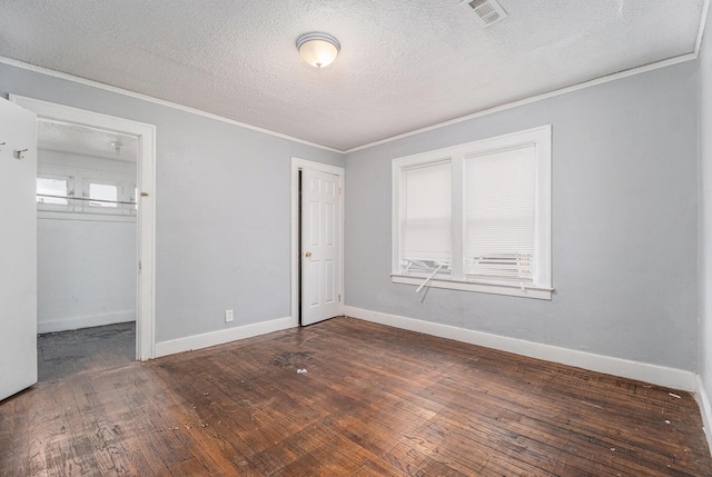 unfurnished bedroom featuring crown molding, a closet, dark hardwood / wood-style floors, and multiple windows