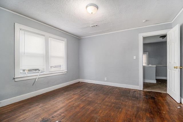 spare room with dark hardwood / wood-style flooring, crown molding, and a textured ceiling