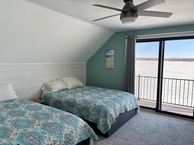 bedroom featuring access to exterior, vaulted ceiling, and a ceiling fan