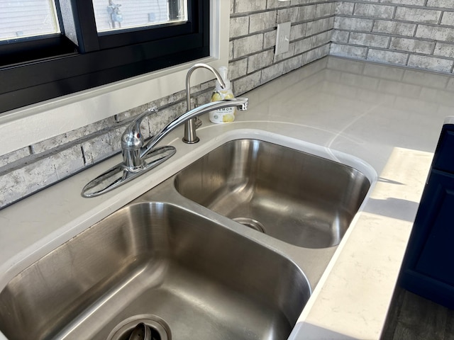 room details featuring light countertops and a sink