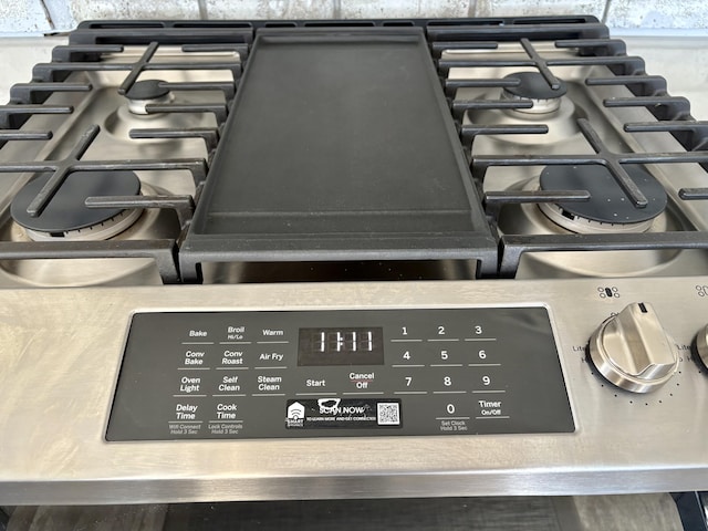 interior details with range with gas cooktop