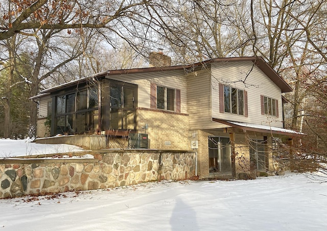 view of front of property featuring a sunroom