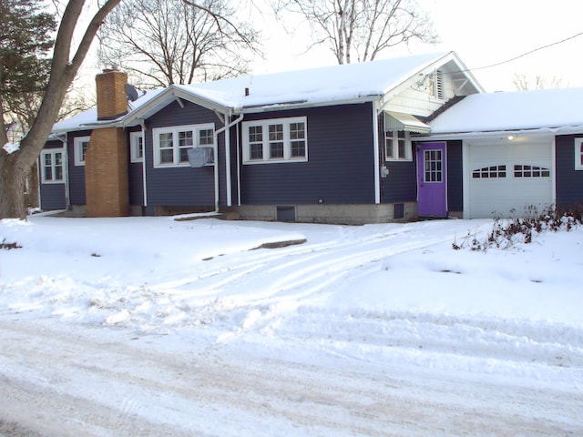 single story home featuring a garage