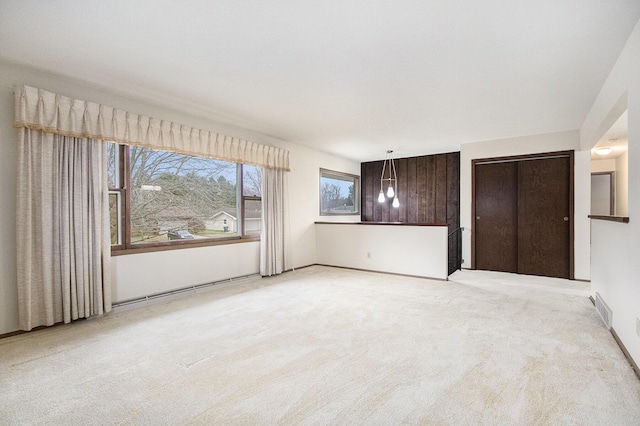 unfurnished bedroom with a closet and light carpet