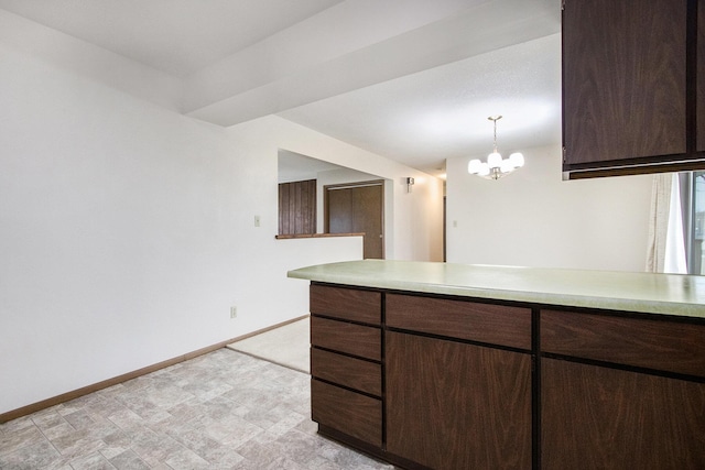 kitchen with dark brown cabinets, decorative light fixtures, and a chandelier